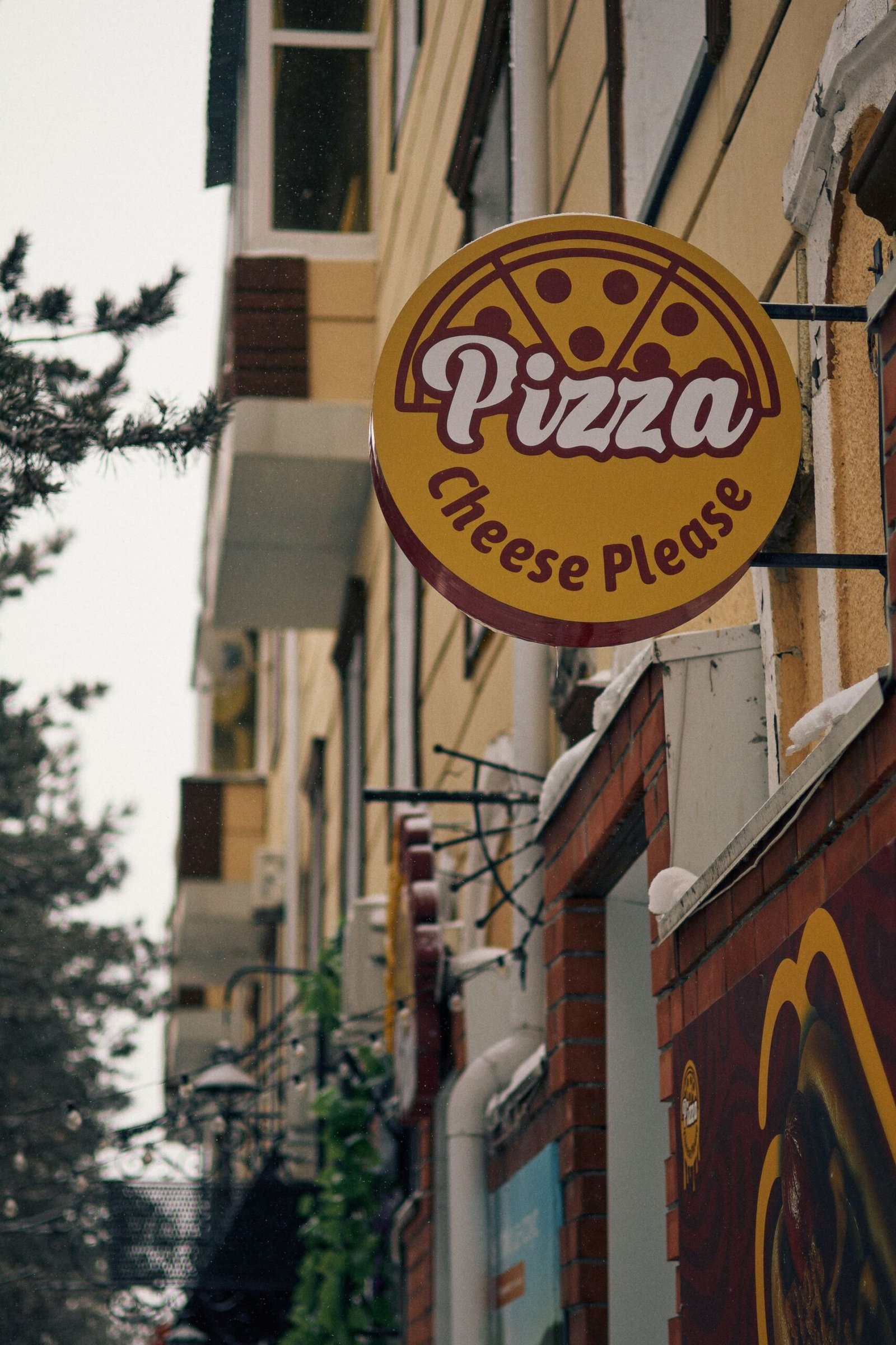 Cozy Pizza Shop Sign on Urban Street