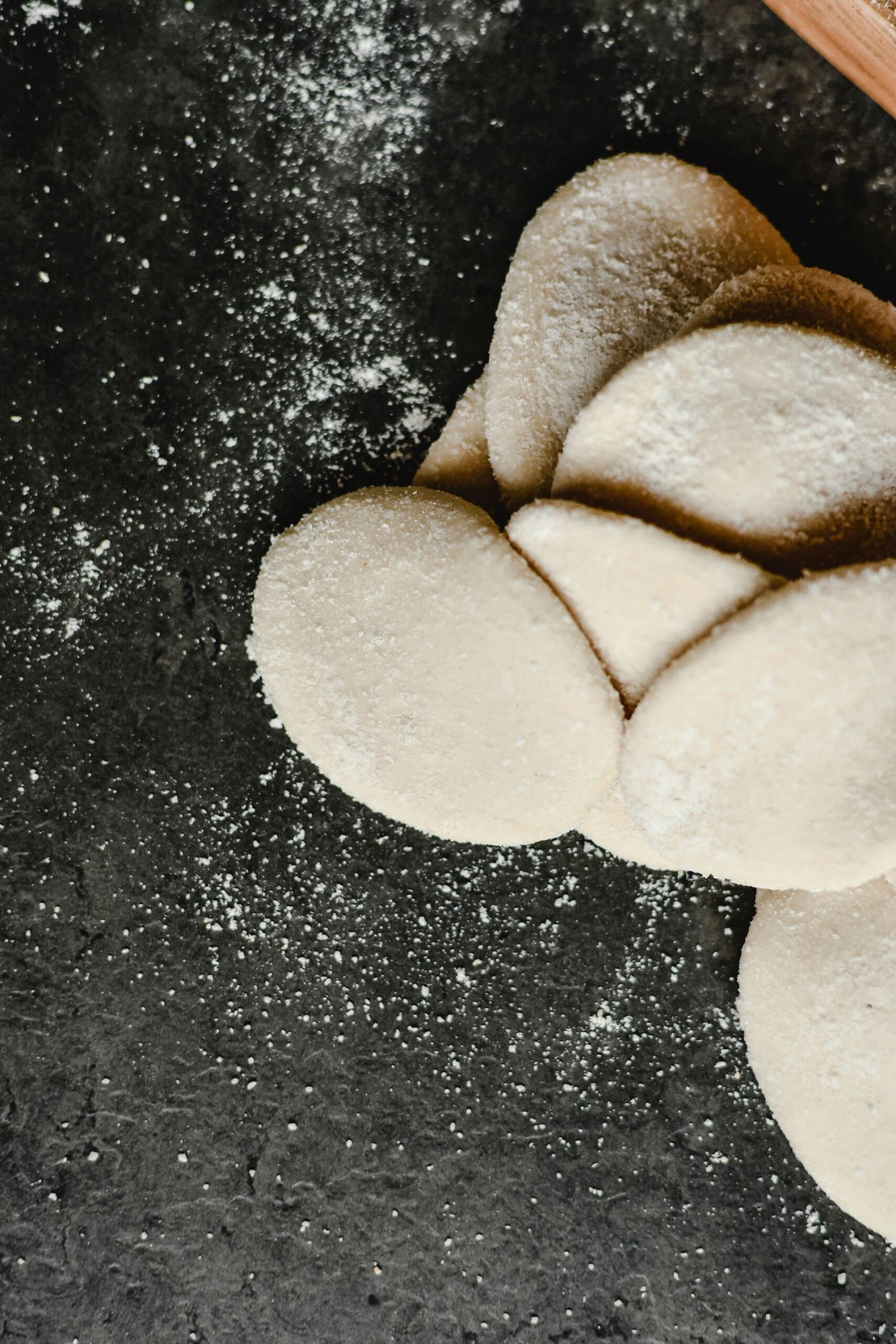 Bunch of Doughs on Black Surface