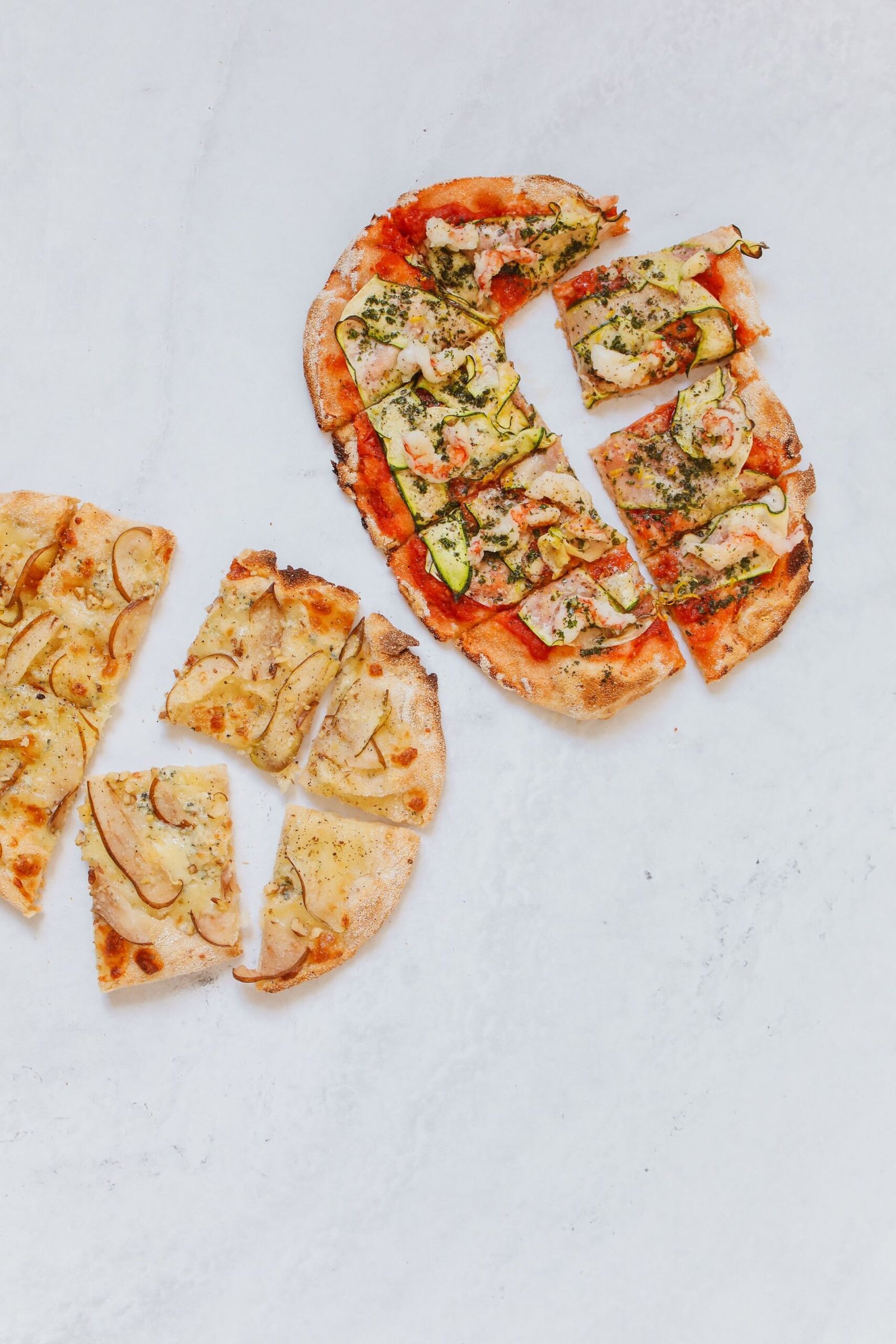 Pizzas on White Table