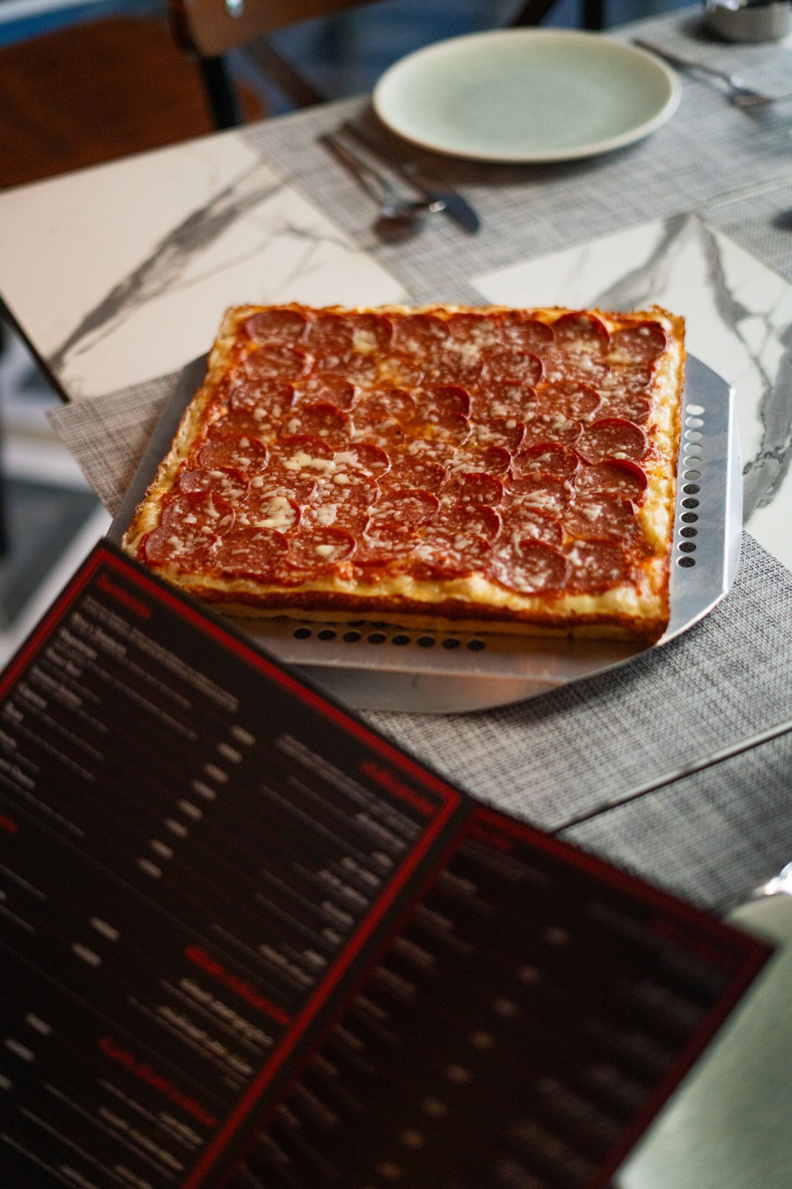 Delicious Pepperoni Pizza on Dining Table