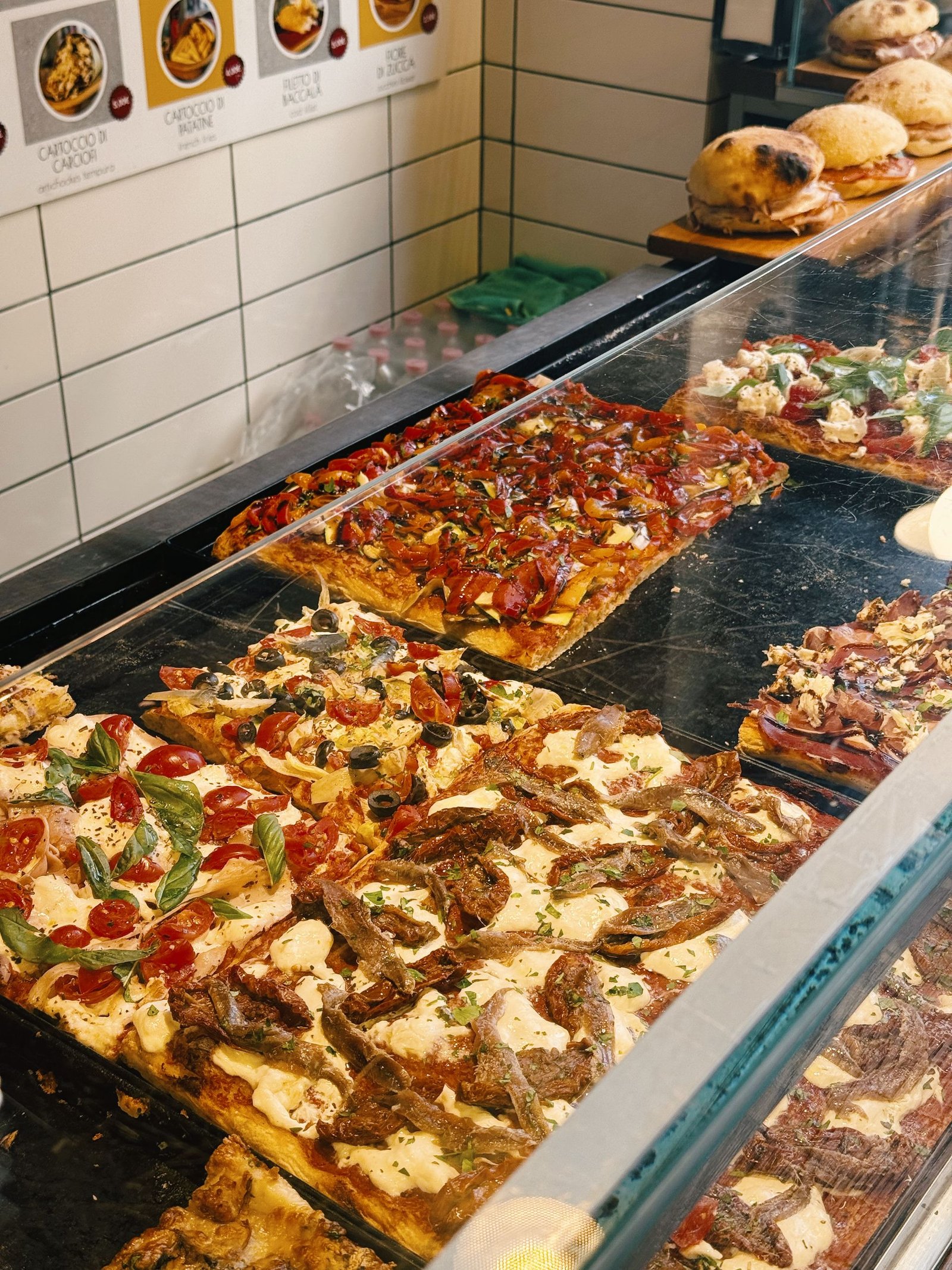 Delicious Variety of Italian Pizzas on Display