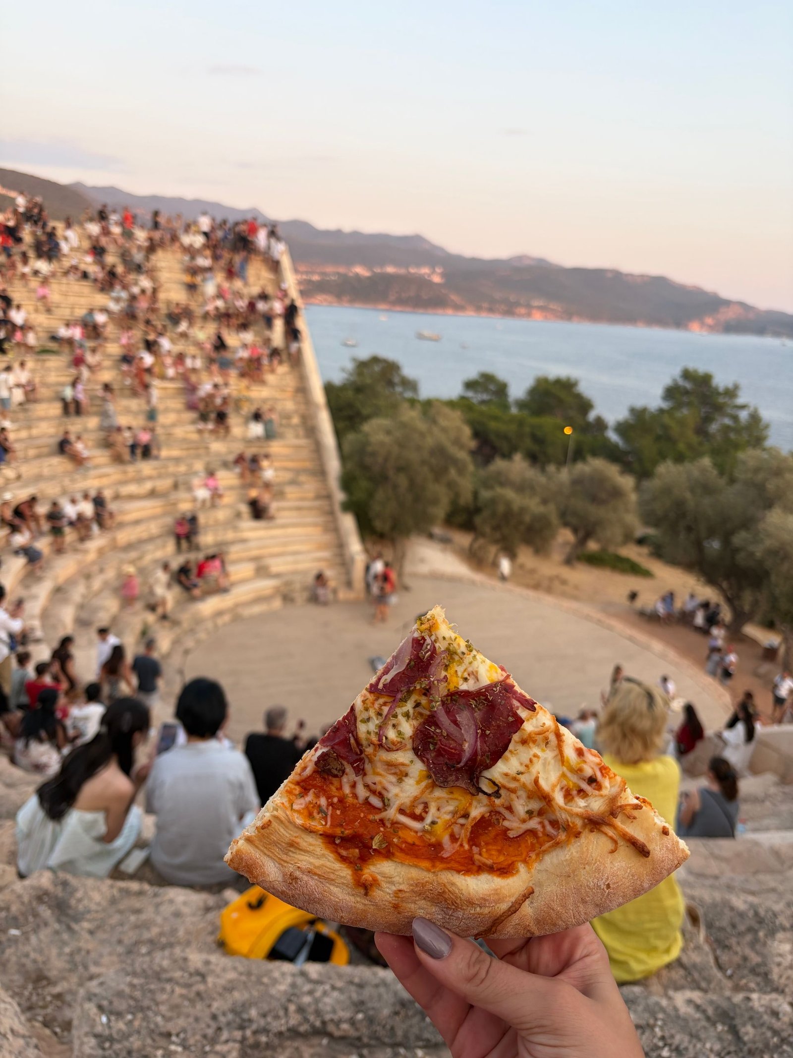 Scenic Pizza Moment at Ancient Amphitheater in KaÅ