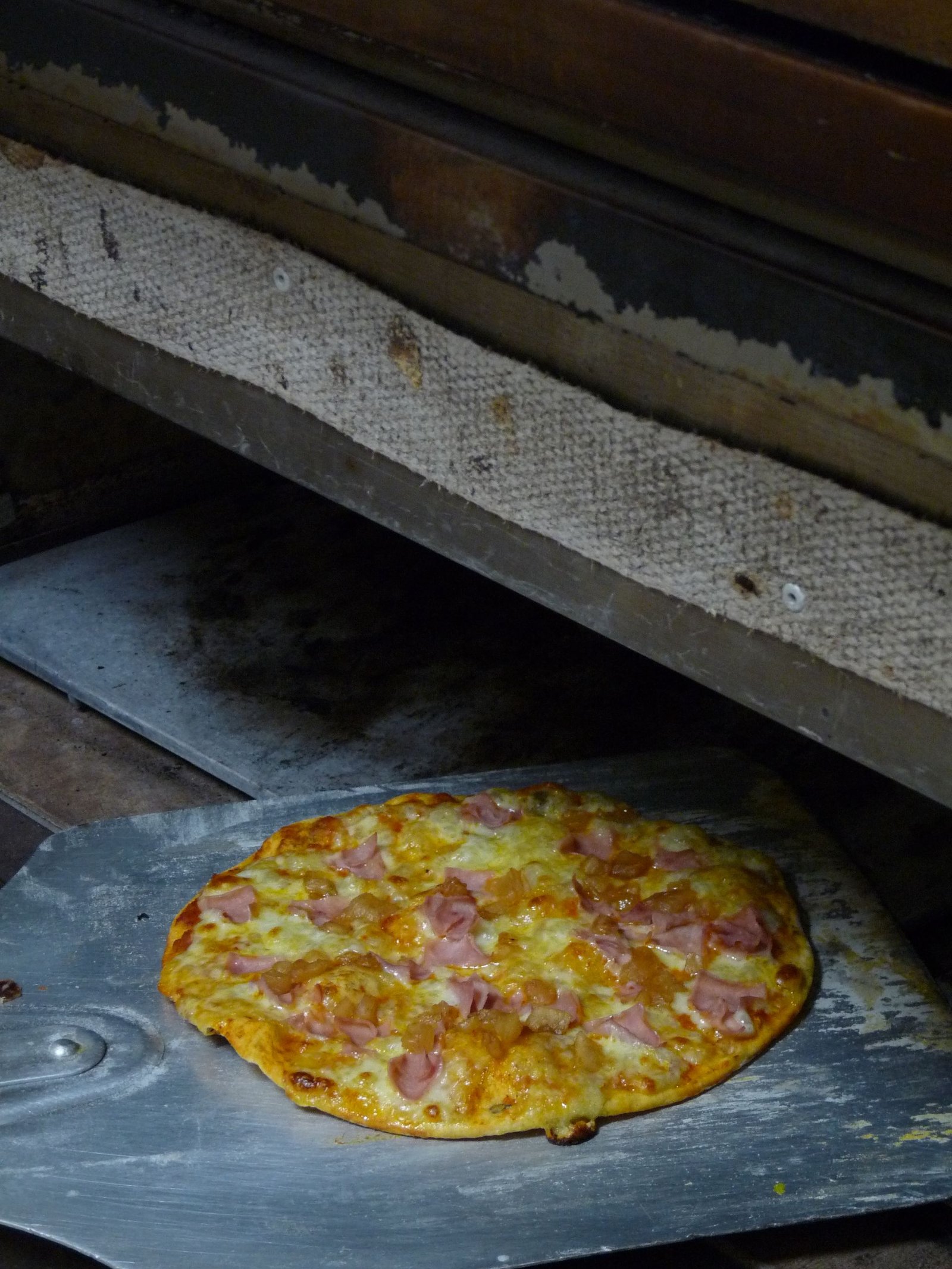Freshly Baked Ham and Cheese Pizza in Oven