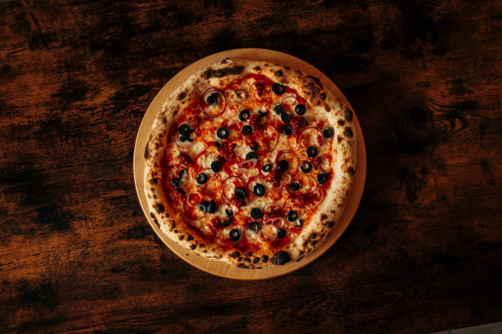 Delicious Pizza with Olives and Pepperoni on Wooden Table