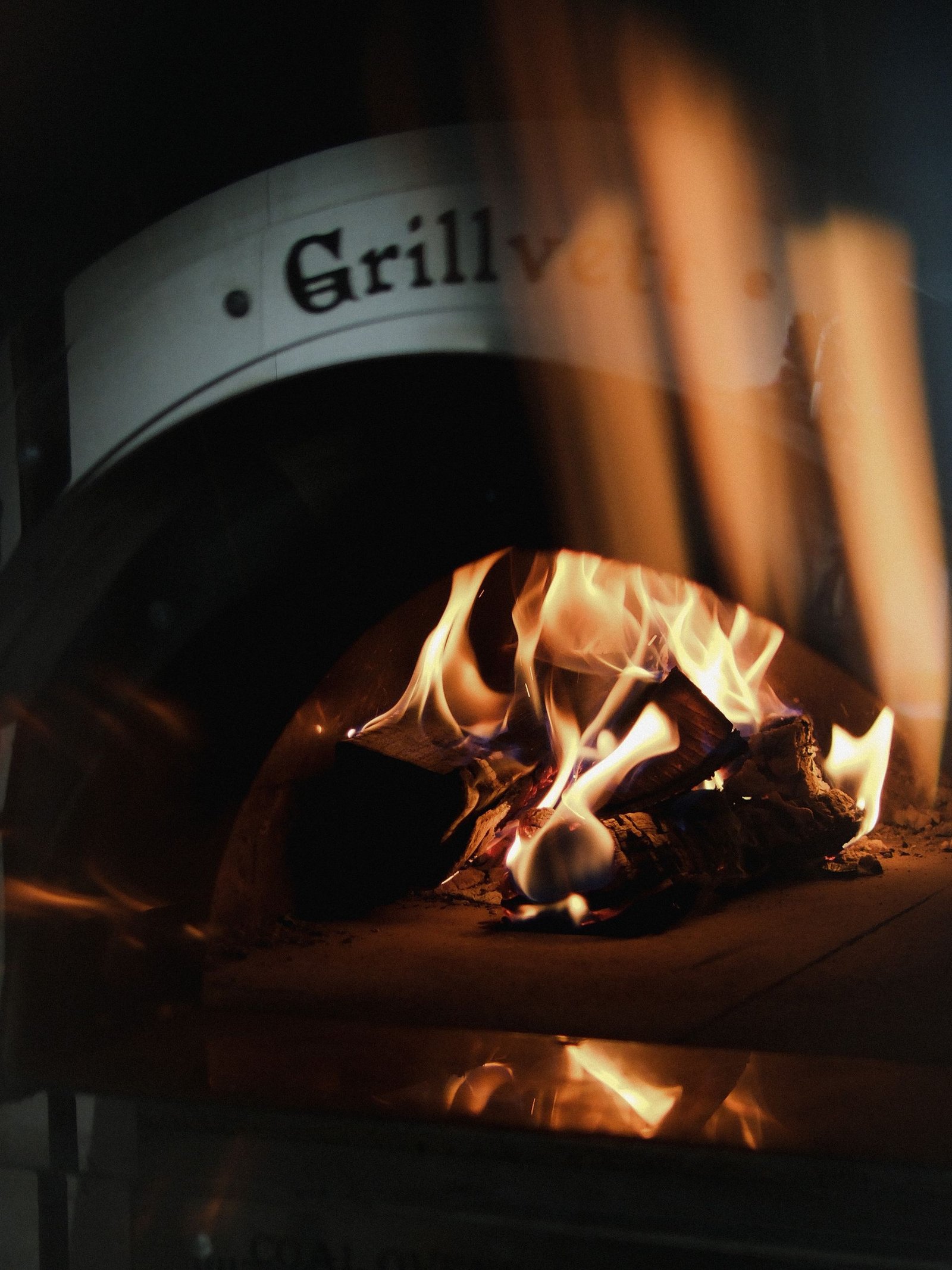 Rustic Wood-Fired Pizza Oven with Flames