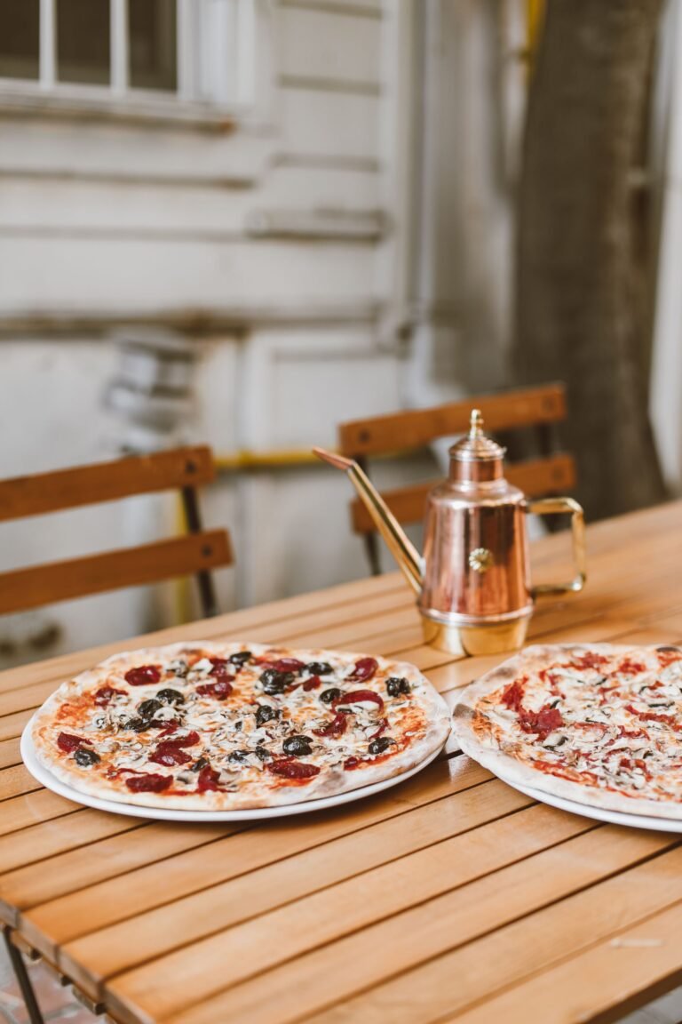 Pizza and Kettle on Wooden Table