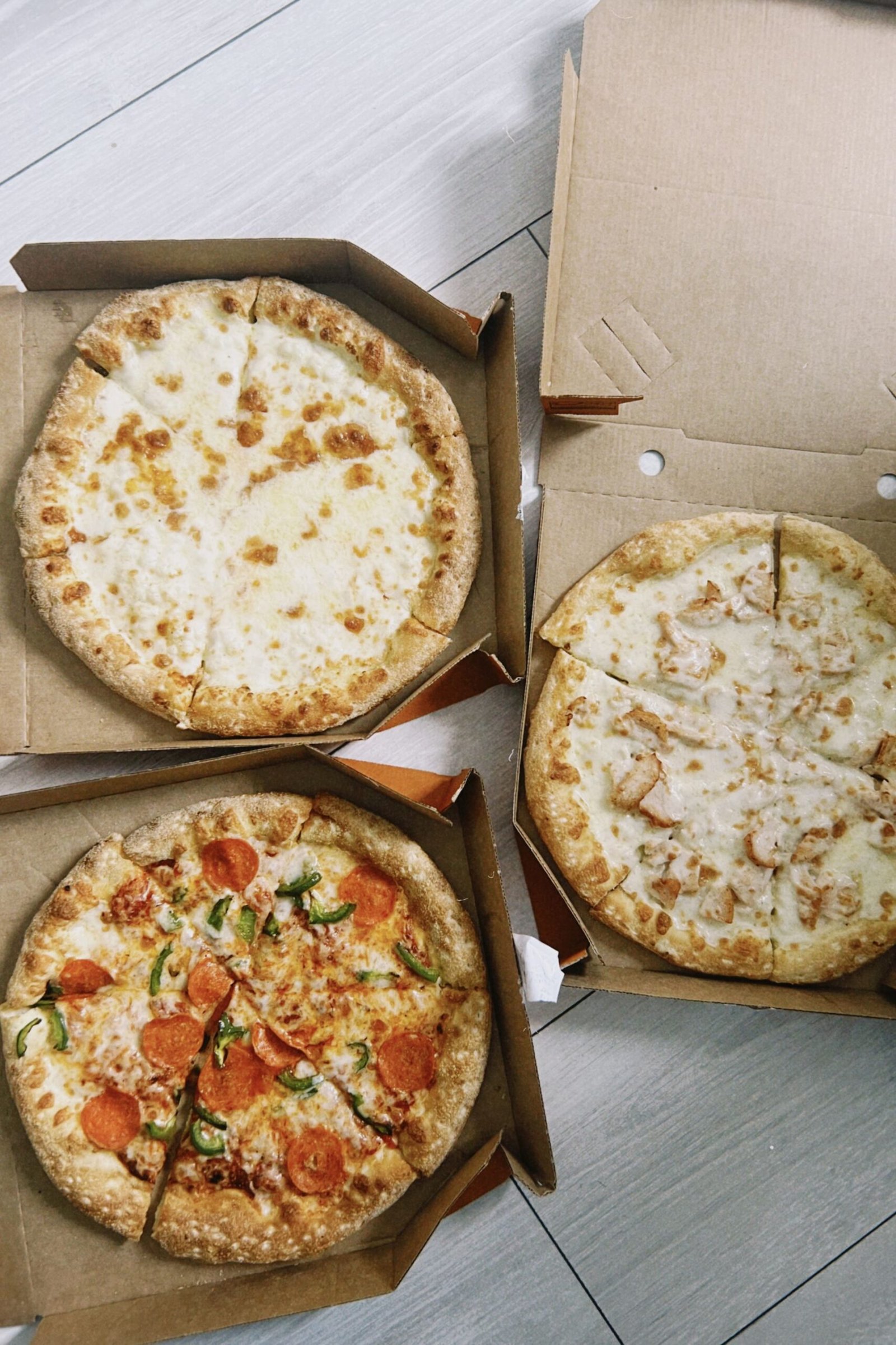 Assorted Pizza Selection in Cardboard Boxes