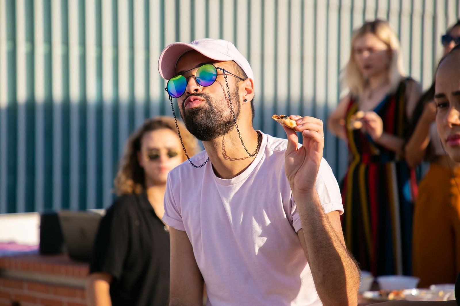 Man Wearing Sunglasses and Enjoying Food