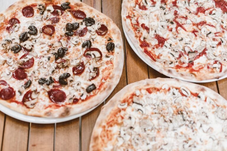 Pizza on Brown Wooden Table