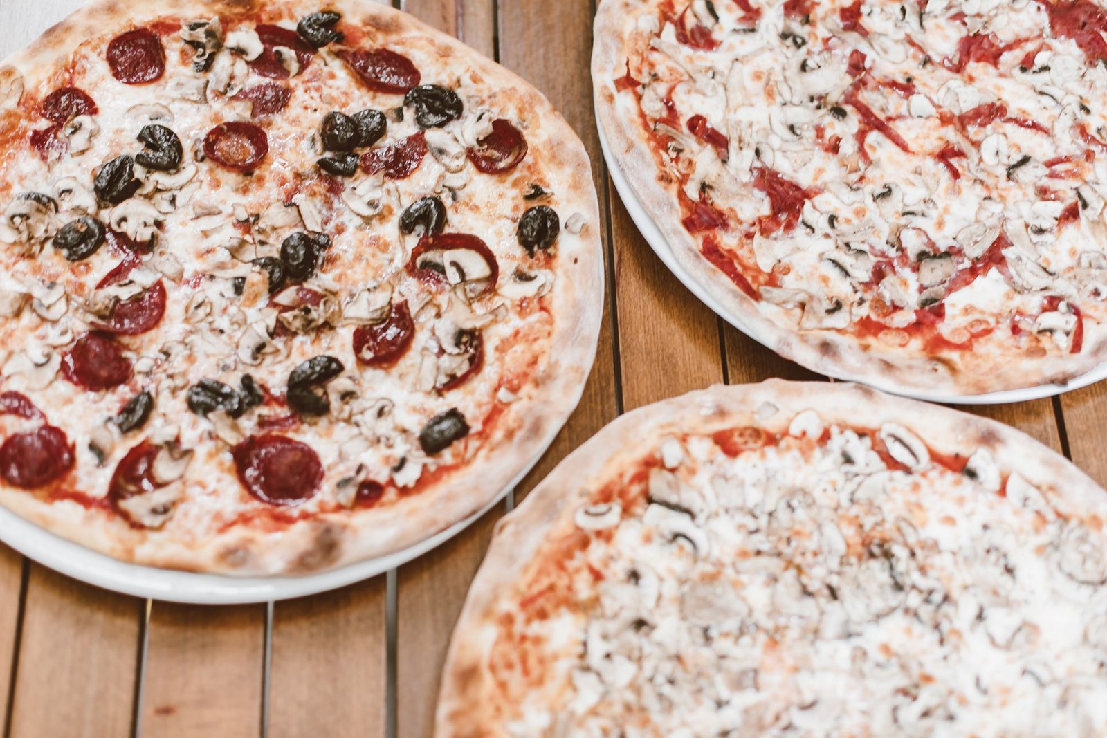 Pizza on Brown Wooden Table