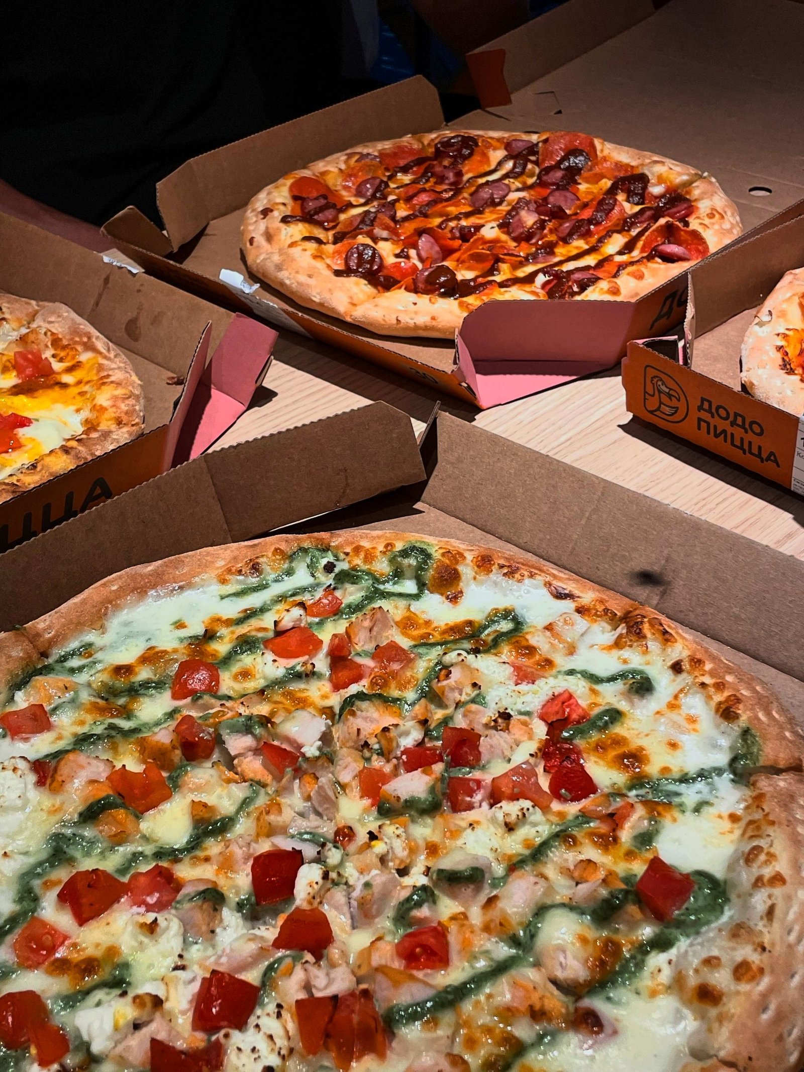 Assorted Flavorful Pizzas in Cardboard Boxes