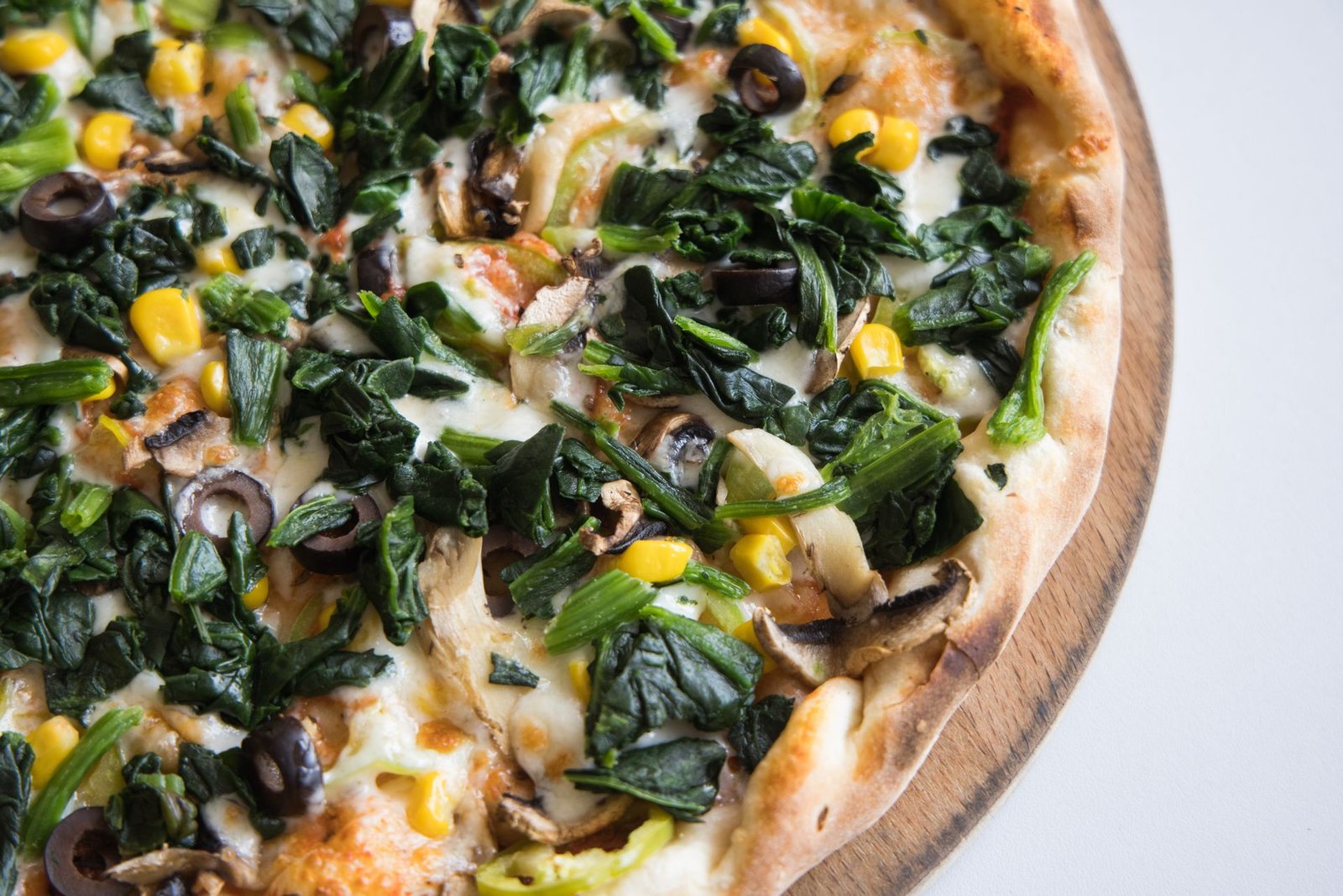 Close-up of Pizza on Wooden Board
