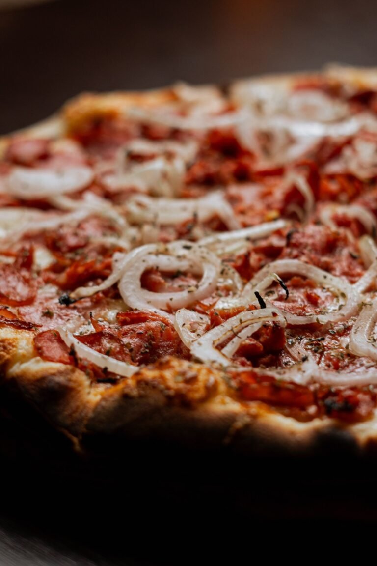 Delicious Pepperoni and Onion Pizza Close-up