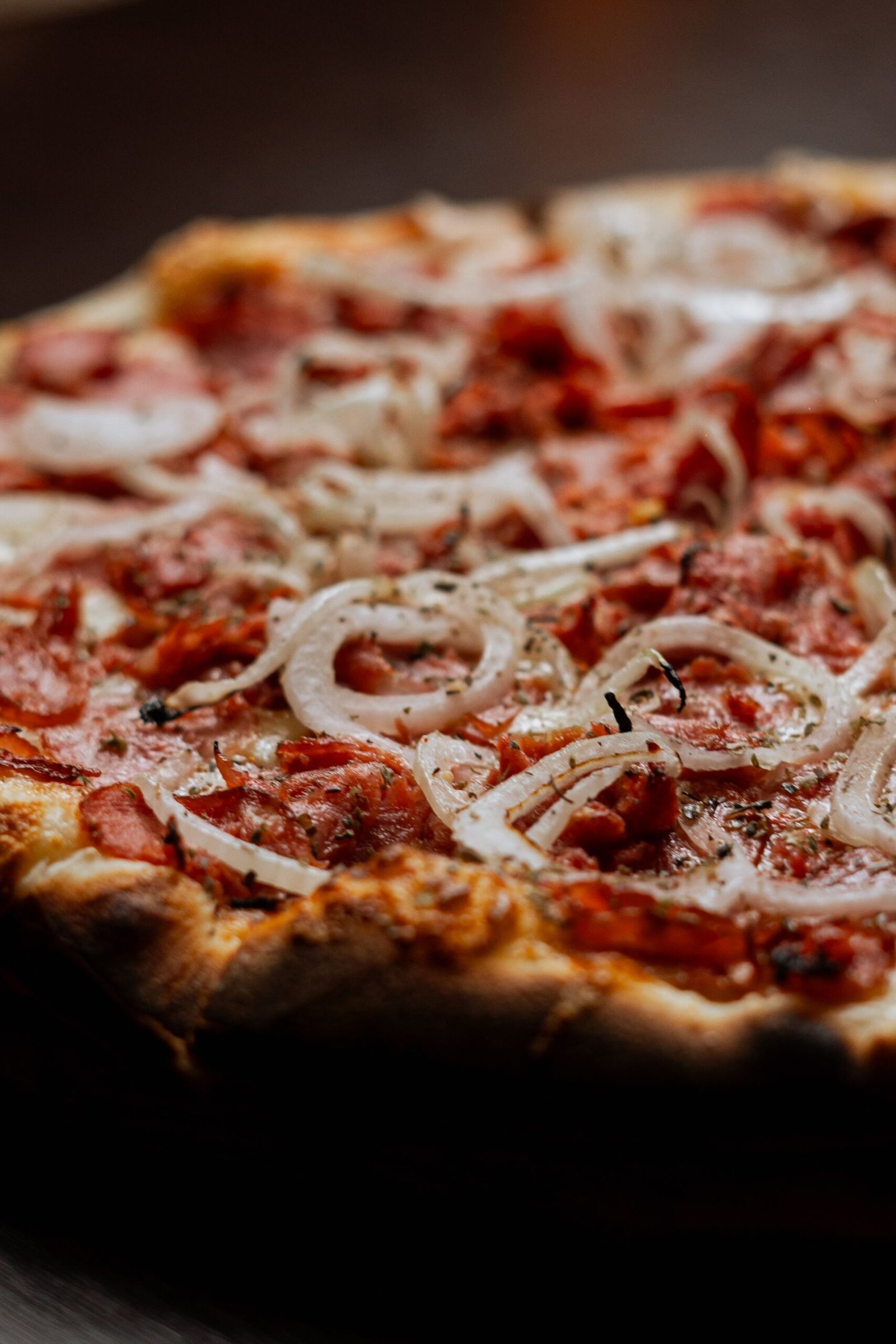 Delicious Pepperoni and Onion Pizza Close-up