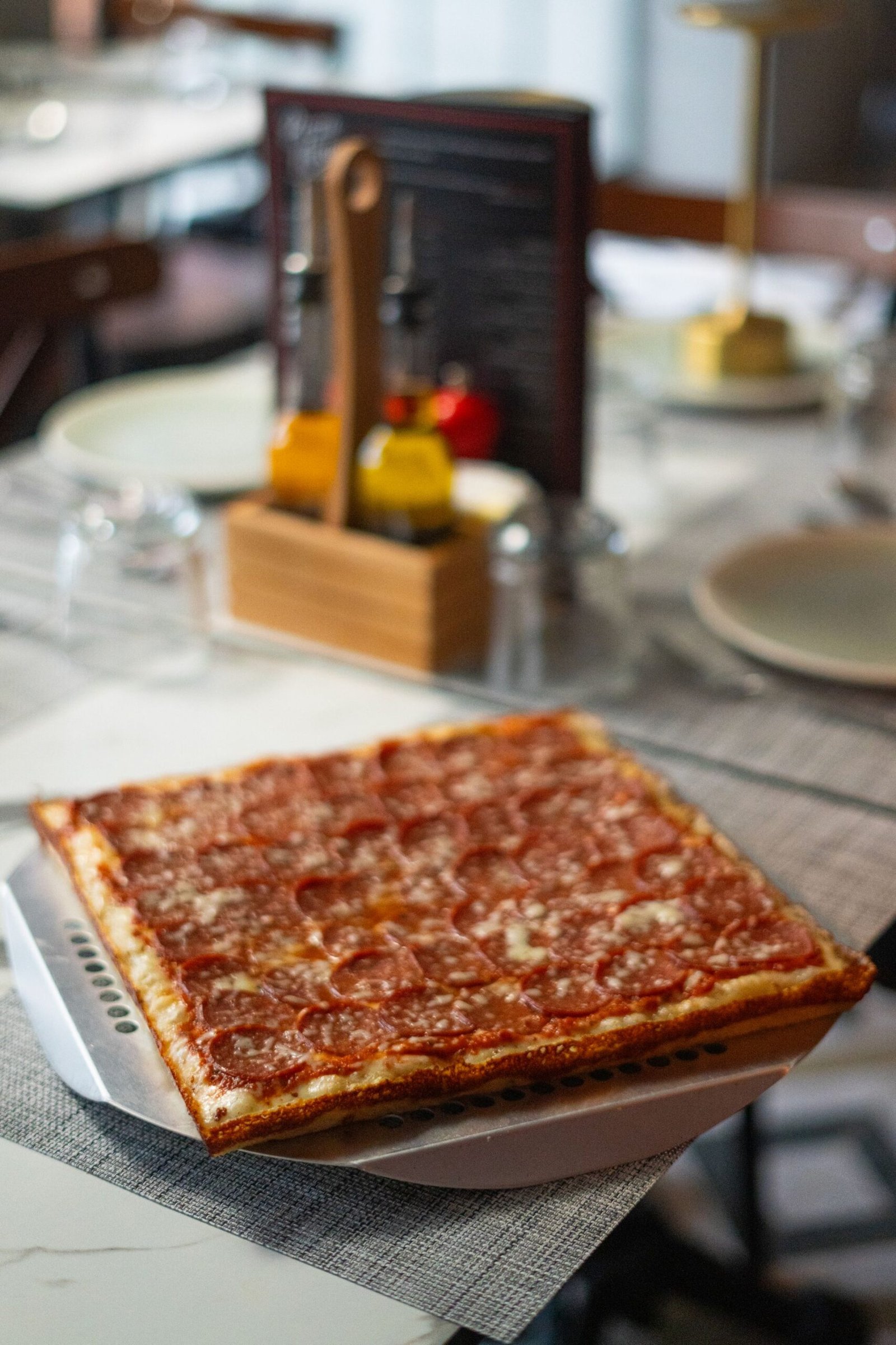 Delicious Pepperoni Pizza on Elegant Table Setting