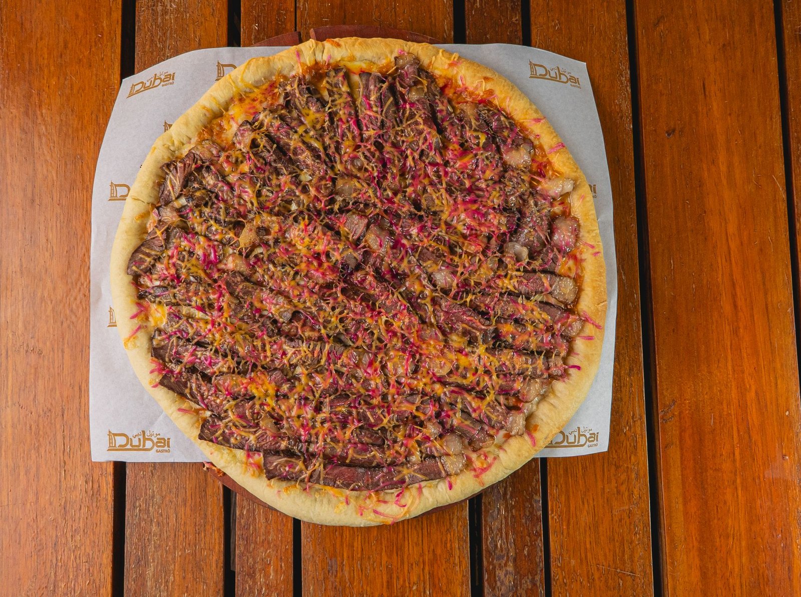 Delicious Gourmet Meat Pizza on Wooden Table