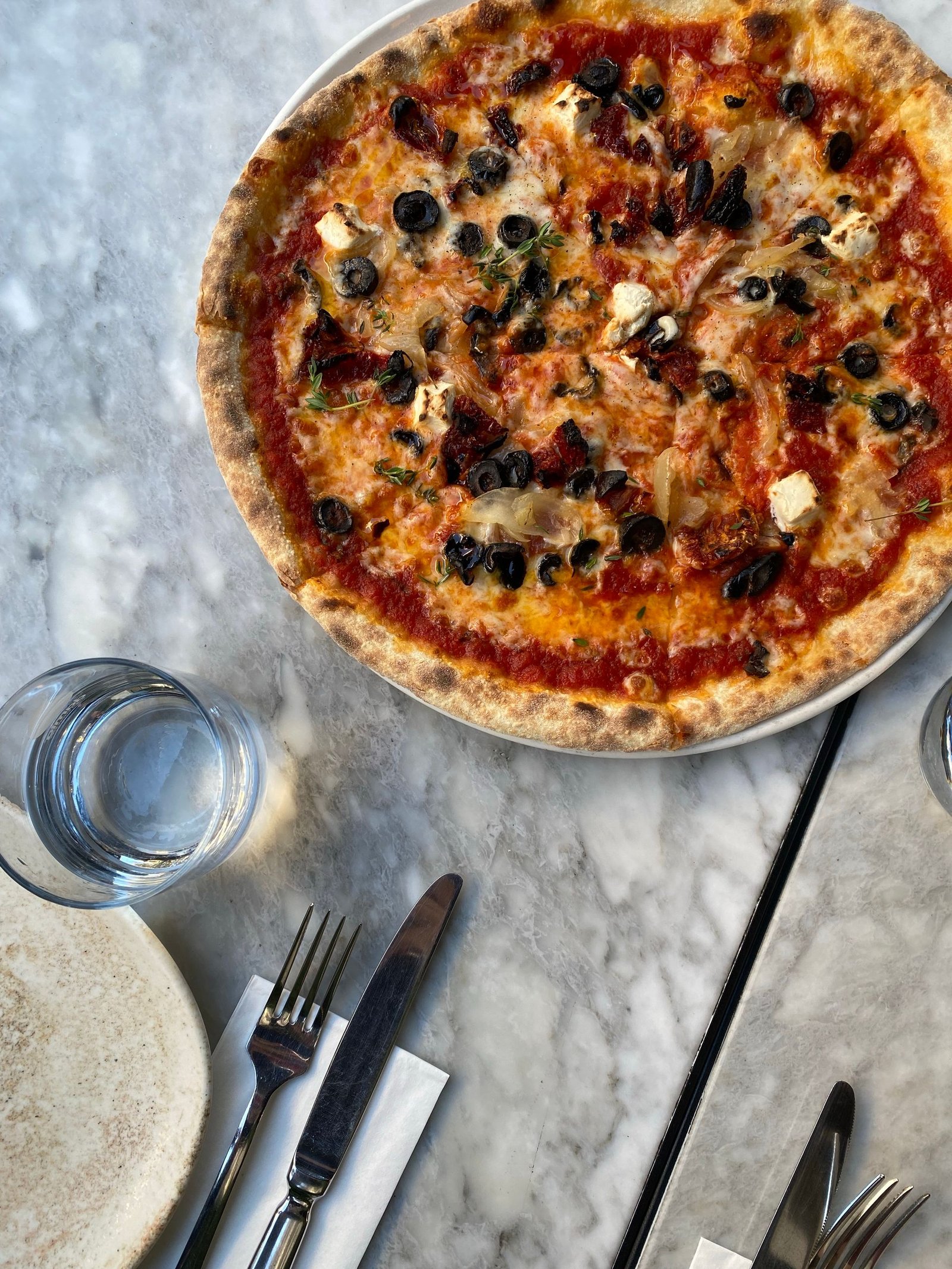 Delicious Mediterranean Pizza on Marble Table