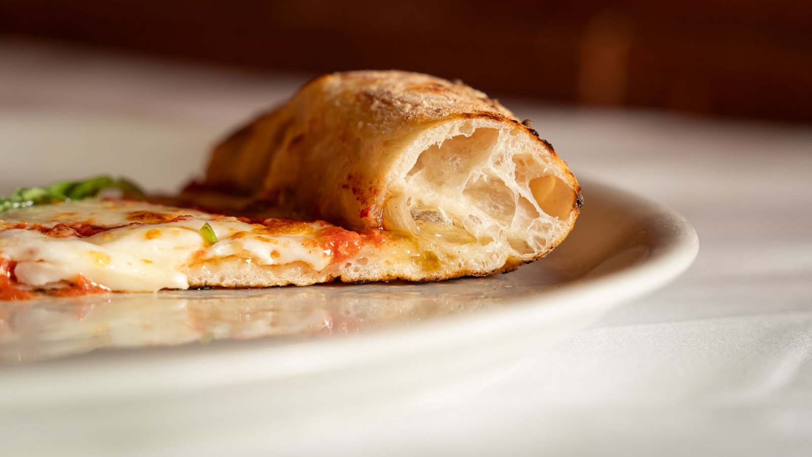 Close-up of a Slice of Margarita Pizza on a Plate