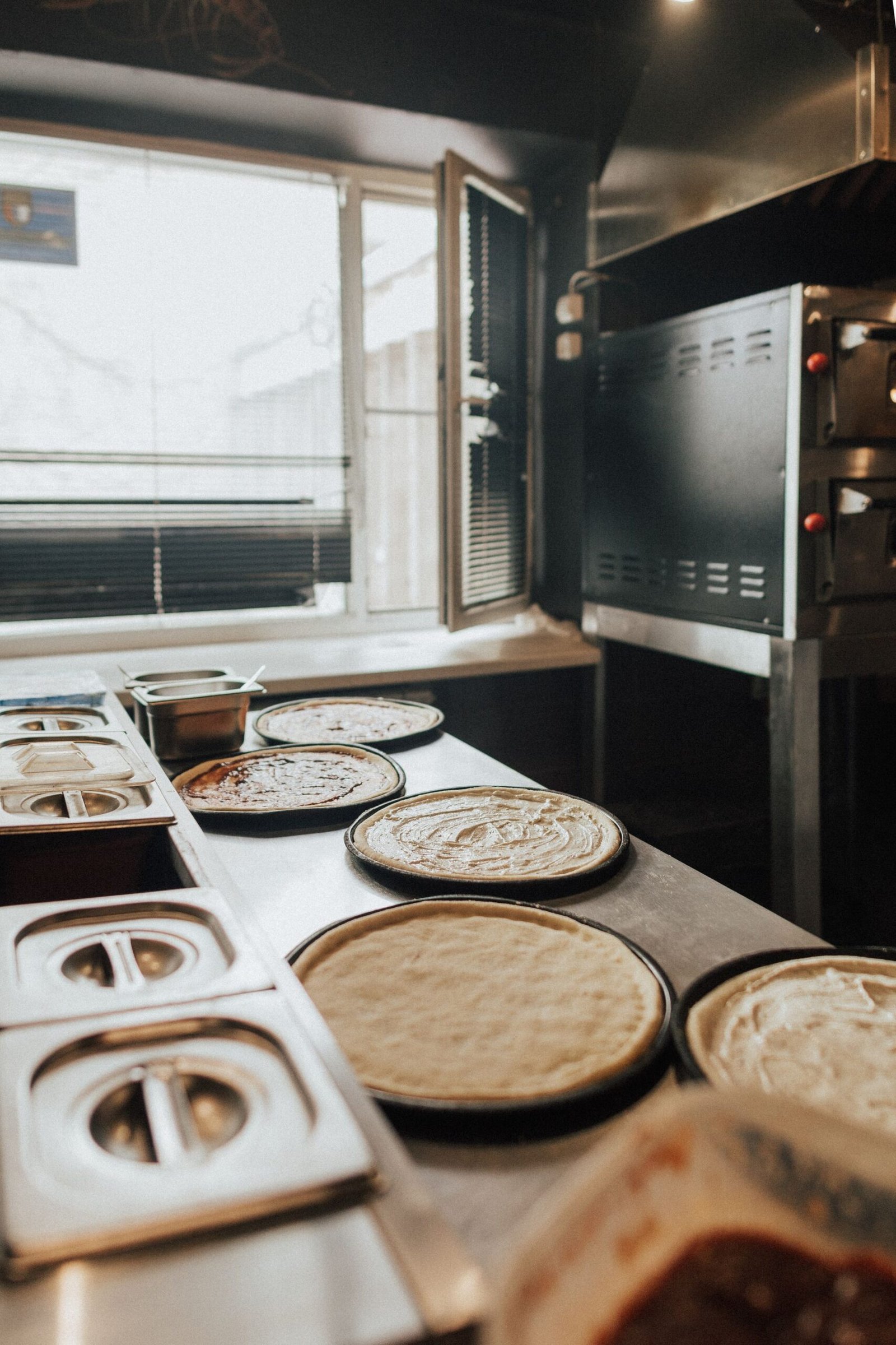 Raw Pizza Dough on the Counter at a Pizzeria